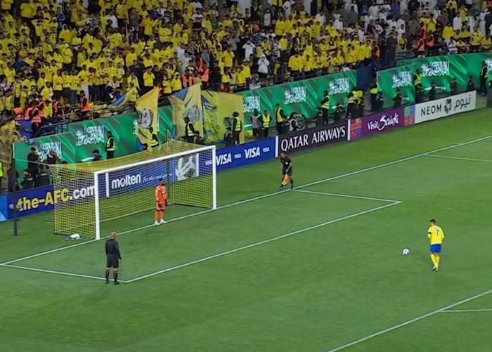 Cristiano Ronaldo pictured (right) moments before he converted a penalty kick for Al Nassr in a losing cause against Al Ain in the AFC Champions League's round of 16 in March 2024